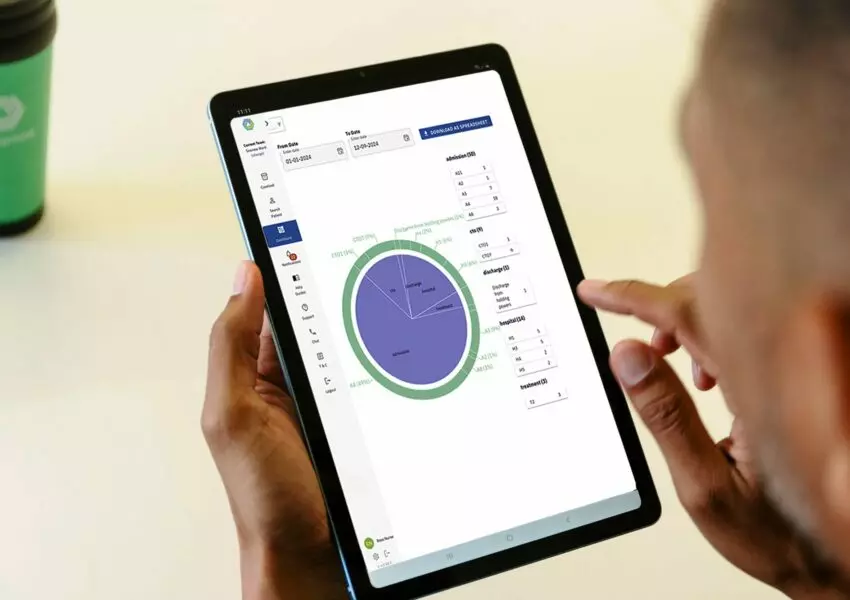 A healthcare worker uses Thalamos technology on an iPad