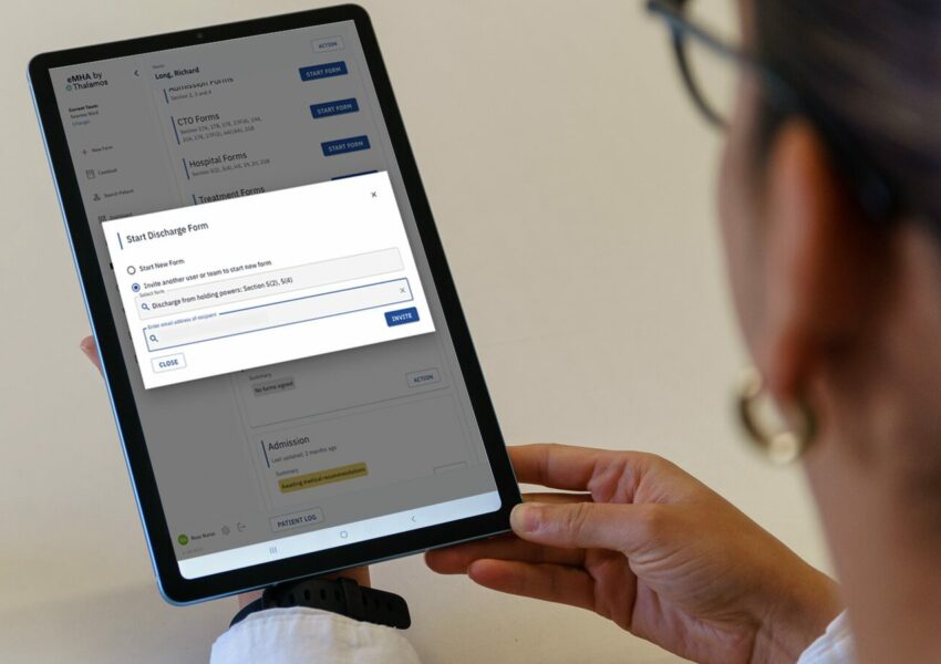A frontline user completes a clincial form on an iPad