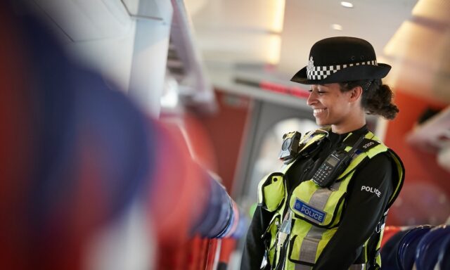 British Transport Police officer on board a train