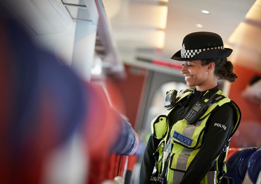 British Transport Police officer on board a train