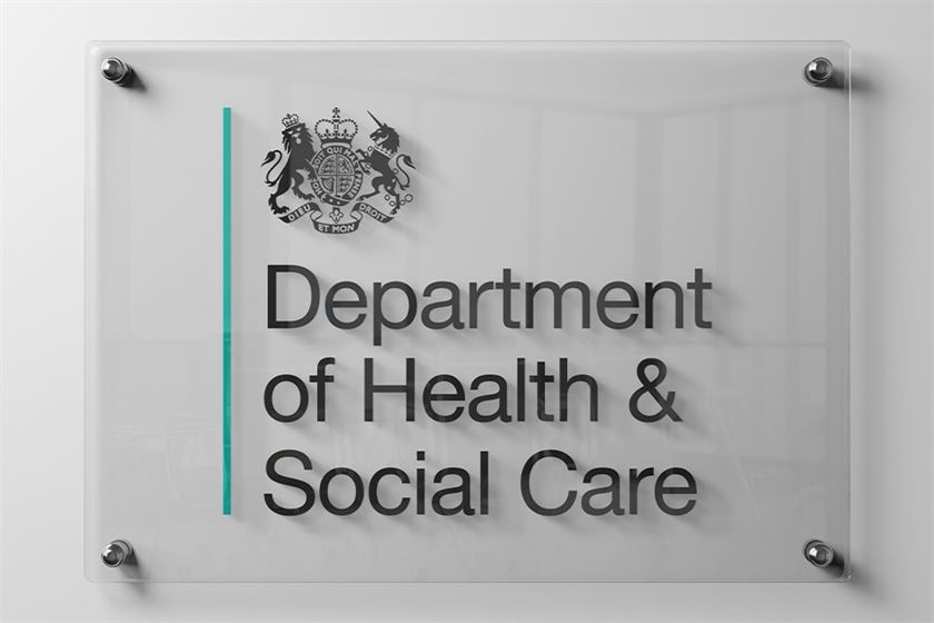 Department of Health & Social Care sign displayed outside a government building.